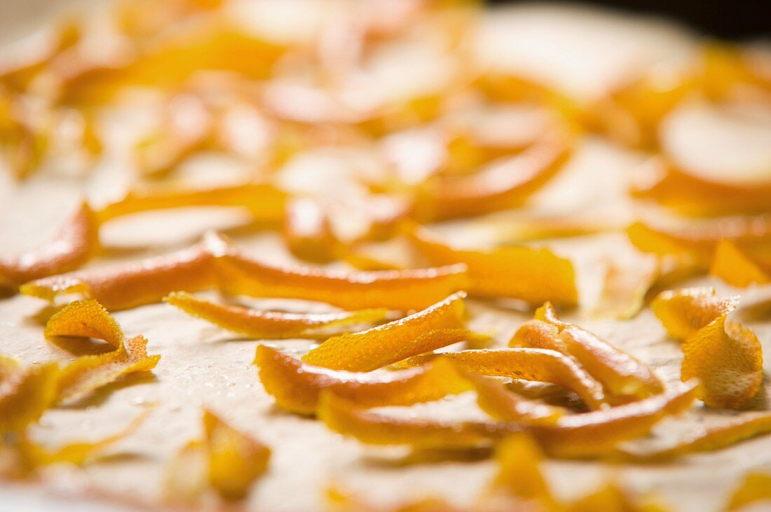 Candied orange peel on a baking tray (close-up)