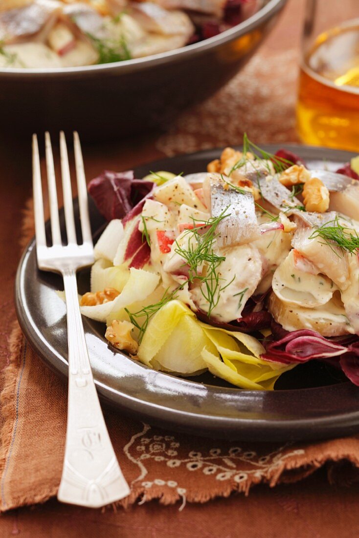 Potato and herring salad on a bed of chicory and radicchio