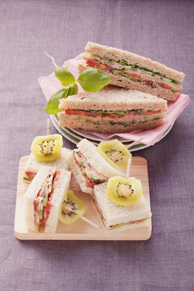 Tuna fish sandwiches and Parma ham and kiwi sandwiches