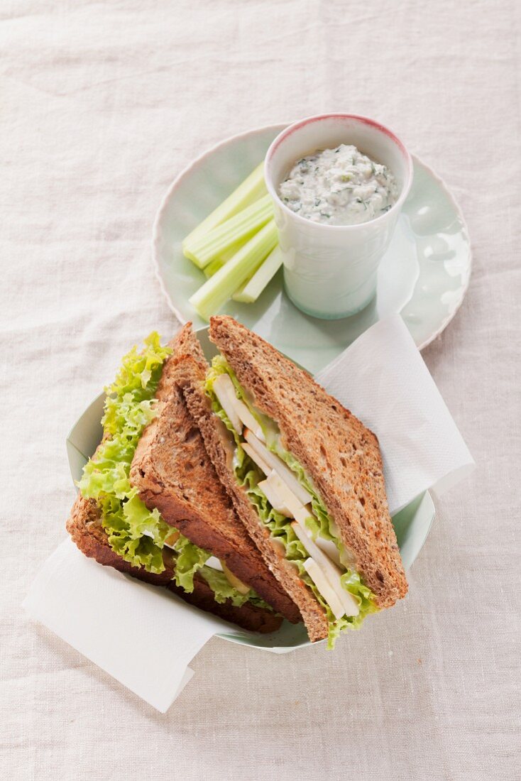 Herb quark with celery and whole wheat sandwich with Camembert and pears