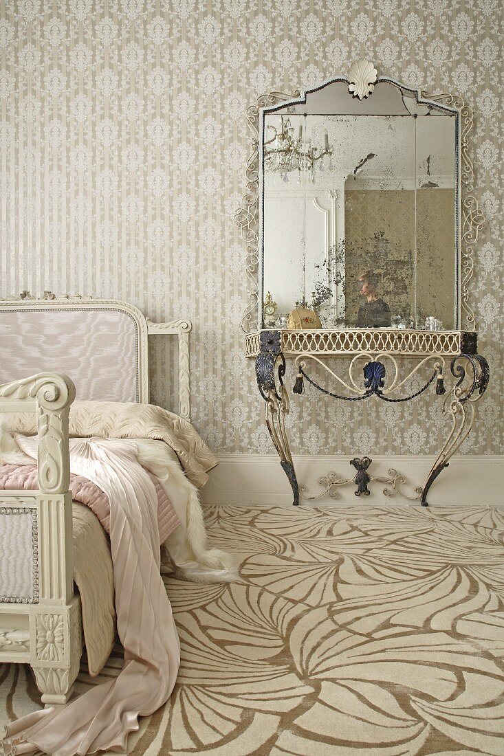 Bedroom with light, patterned wallpaper and carpet with light, modern pattern