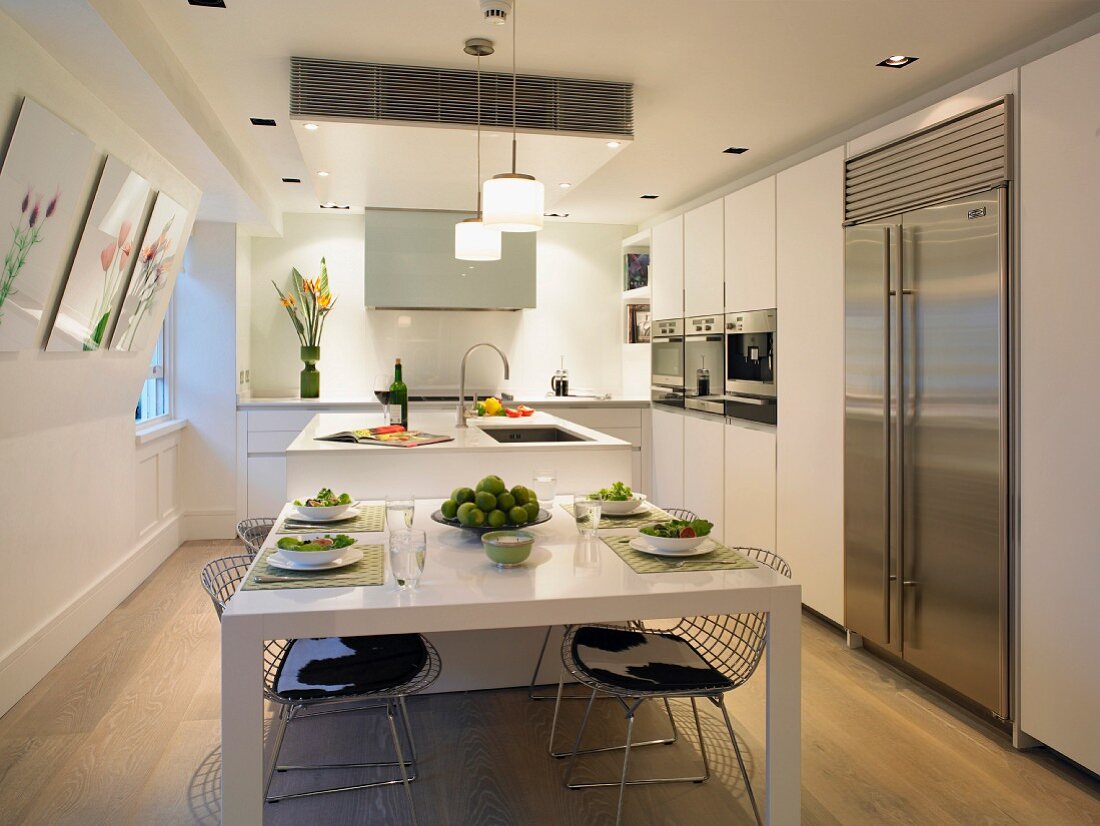 Set dining table in white designer kitchen