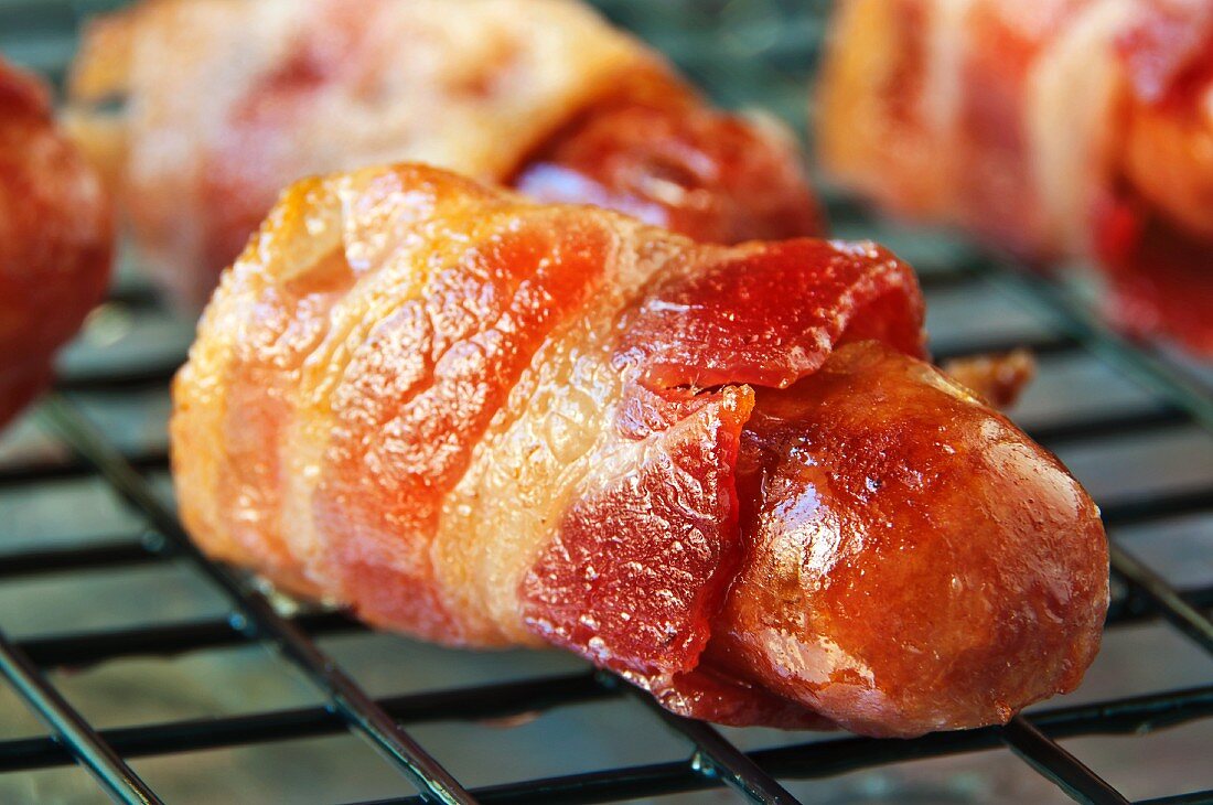 Bacon Wrapped Cocktail Frank on a Cooling Rack