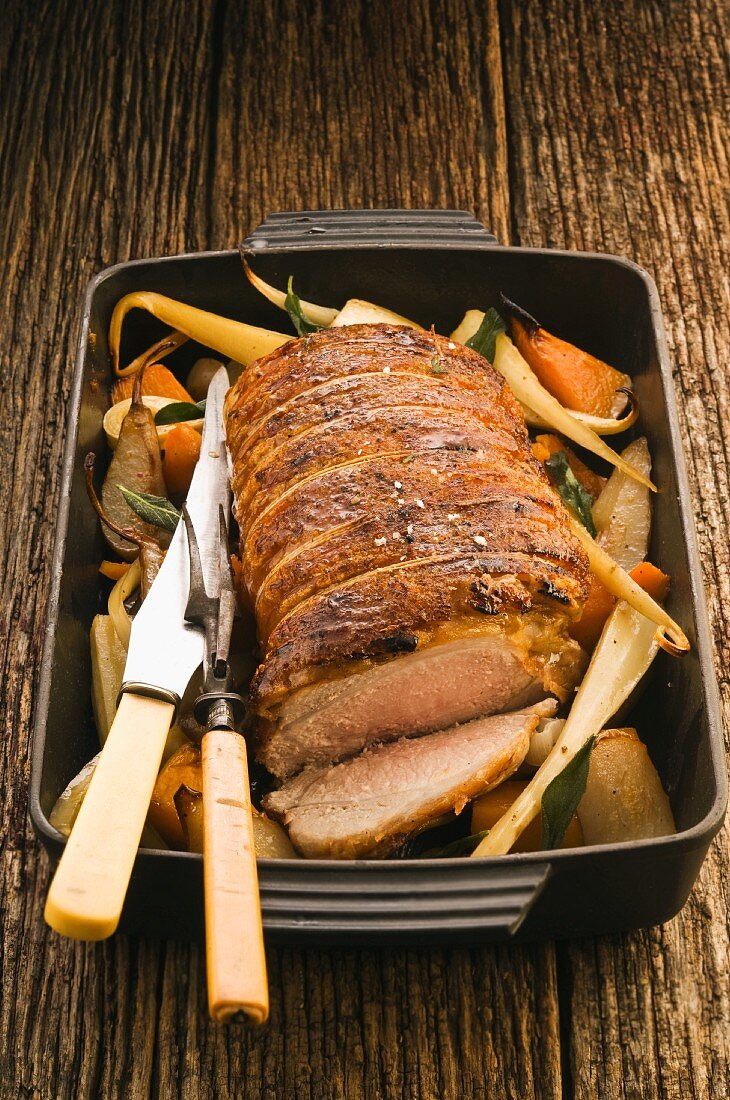 Rolled roast pork with pears and parsnips
