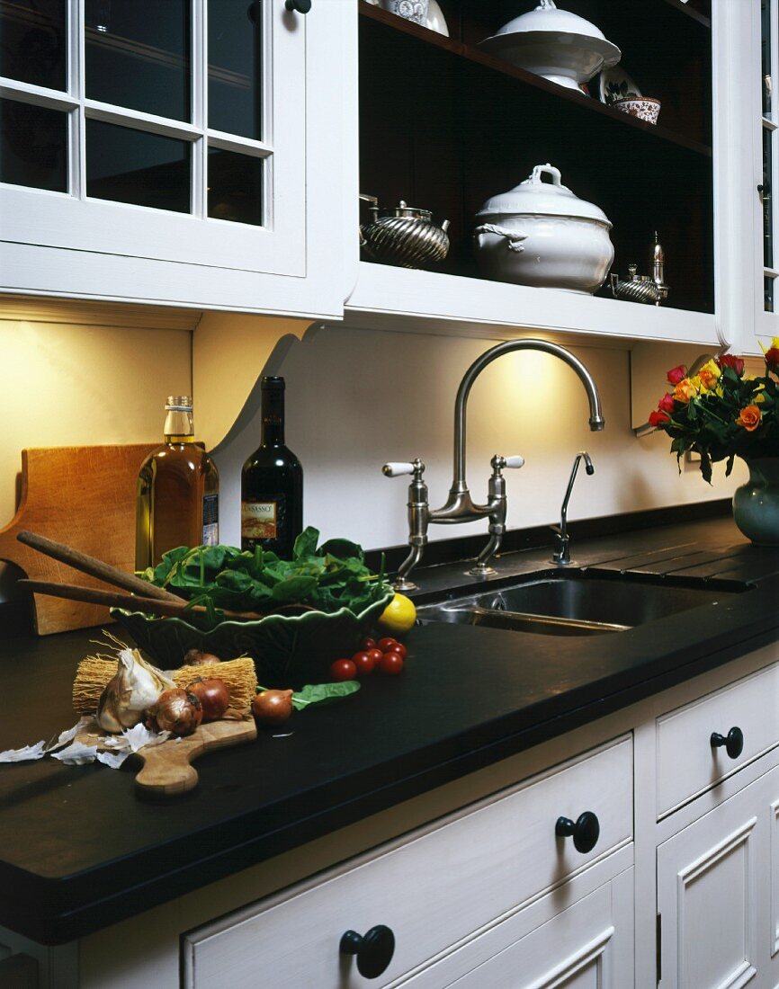 Food preparation on work surface of country house style kitchen counter