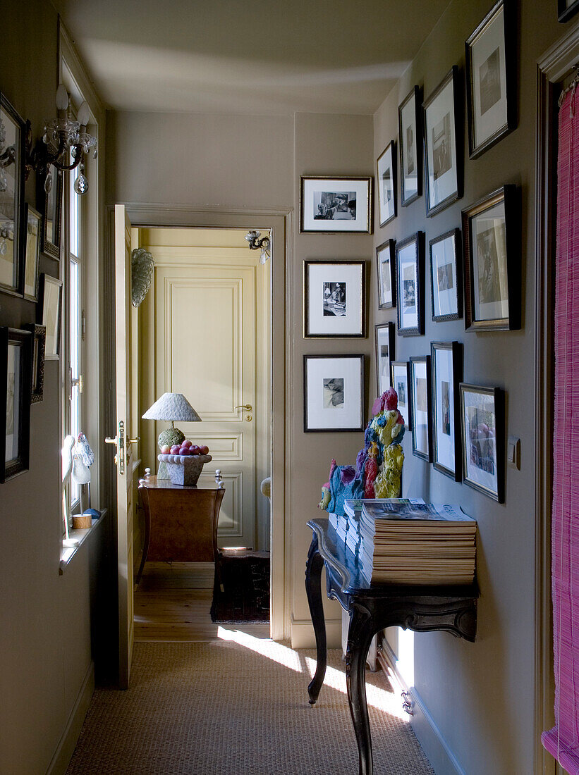 Traditional-style hallway with picture gallery and console