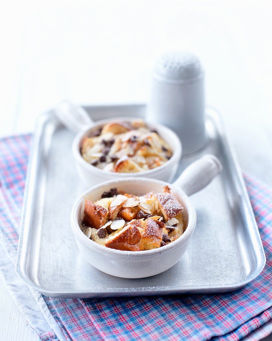 Brioche pudding with chocolate chips and flaked almonds