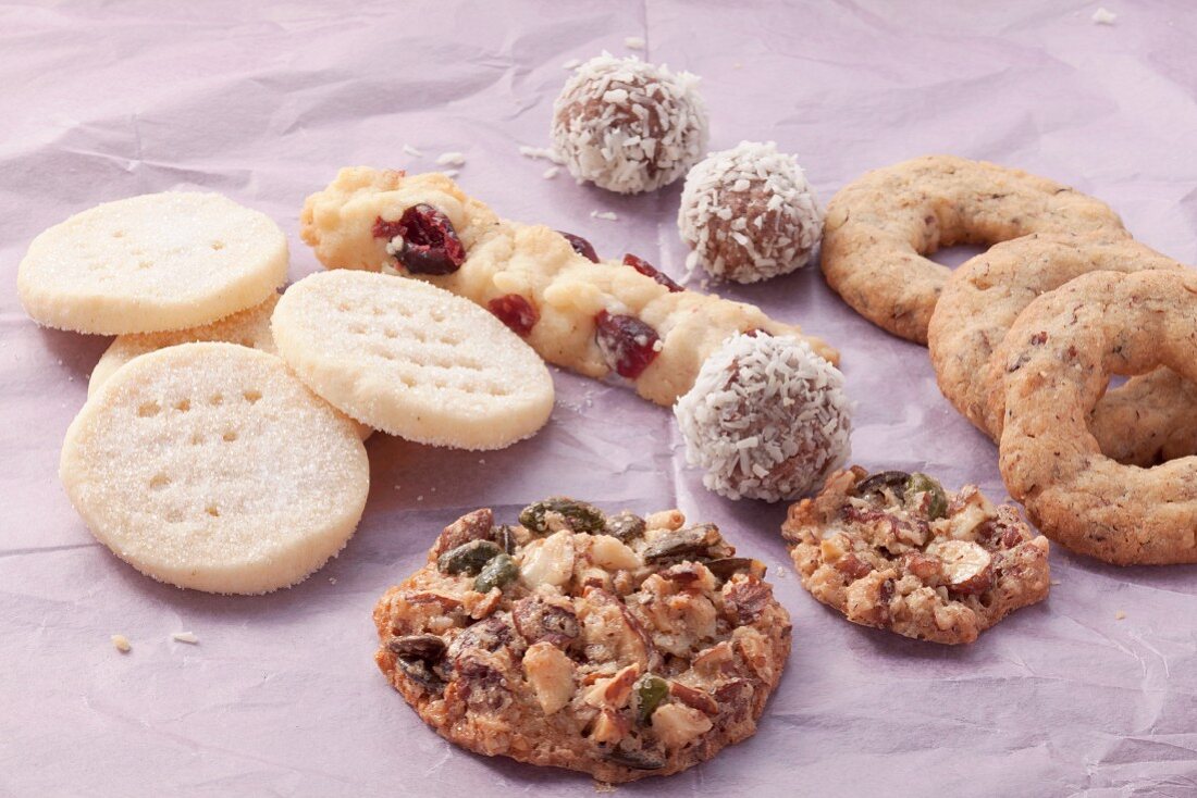 Assorted cookies on a purple surface