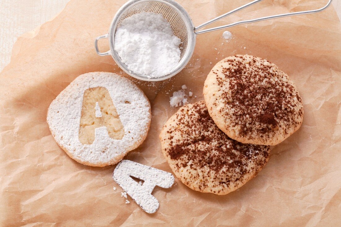 Cookies with powdered sugar designs and with cocoa powder