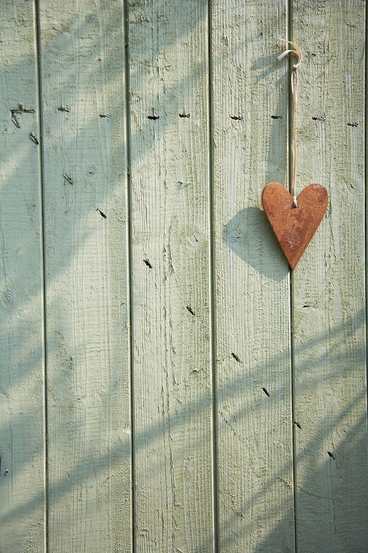 Heart hanging on a wooden door