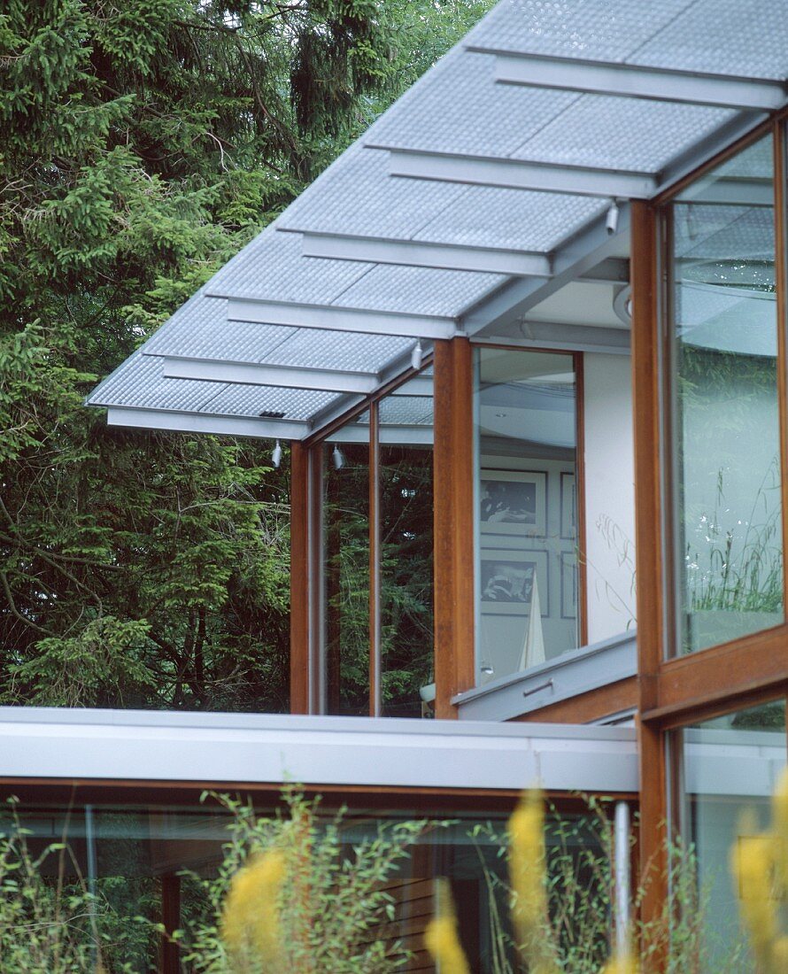 Contemporary house with wood and glass facade