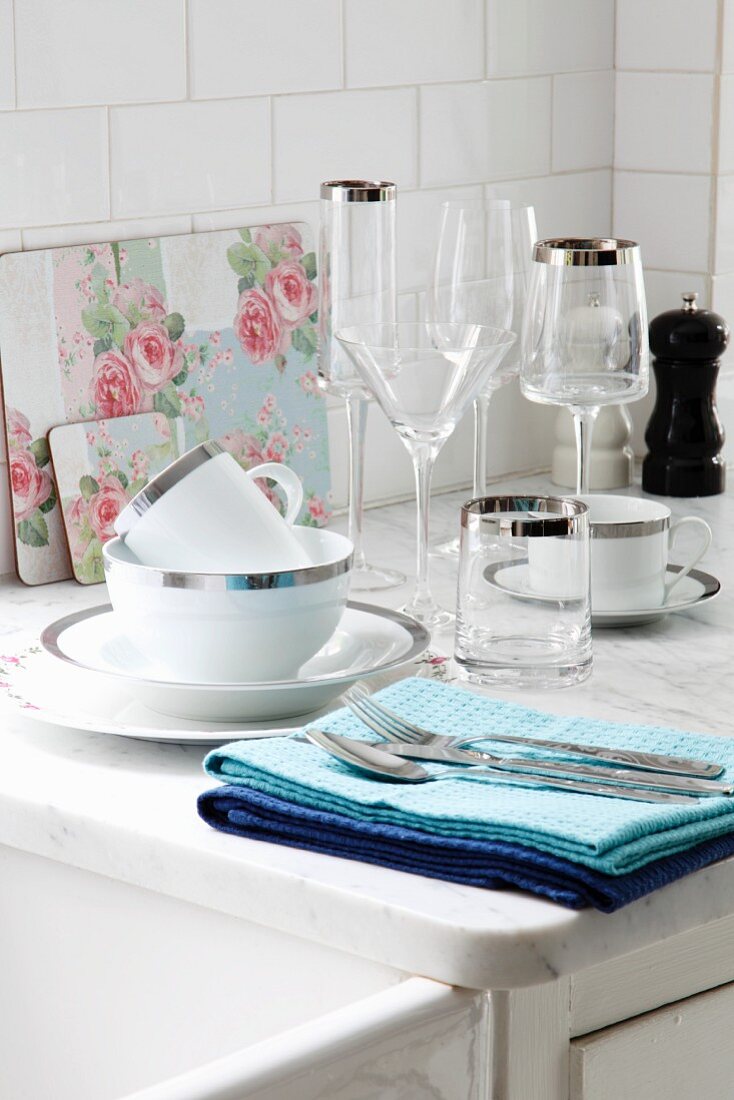 Festive crockery and glasses with silver edges