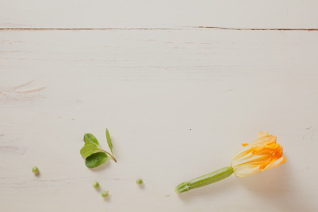 Courgette flower on wooden background