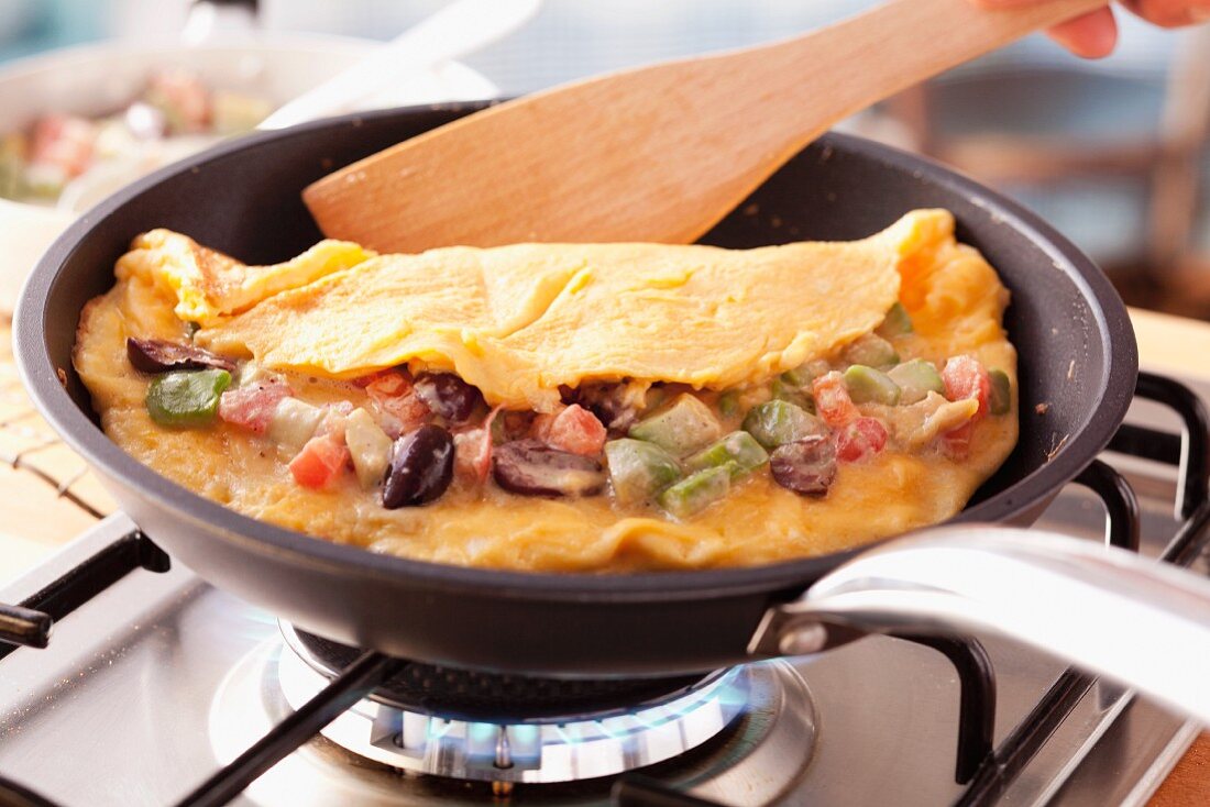Vegetable omelette in frying pan
