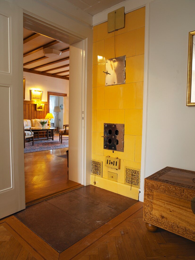 Simple lobby with a view through an open door into a living room