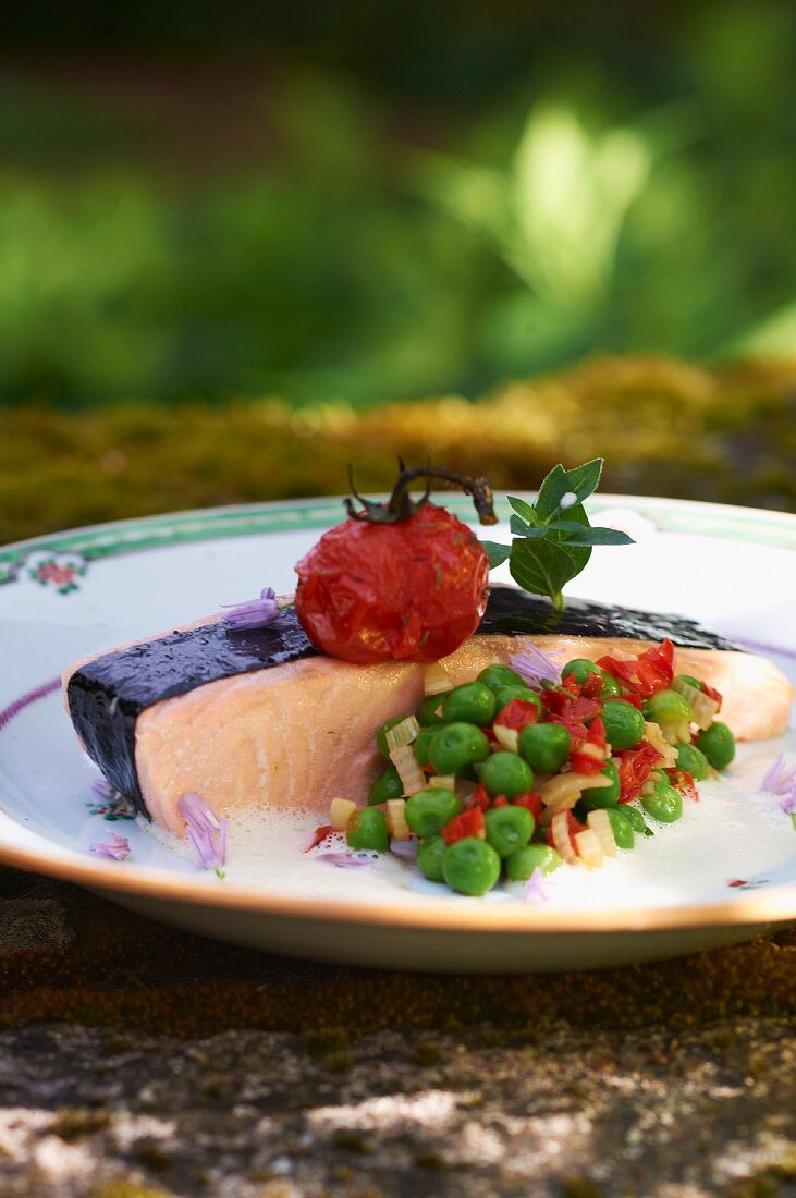 Salmon fillet wrapped in nori with a pea medley