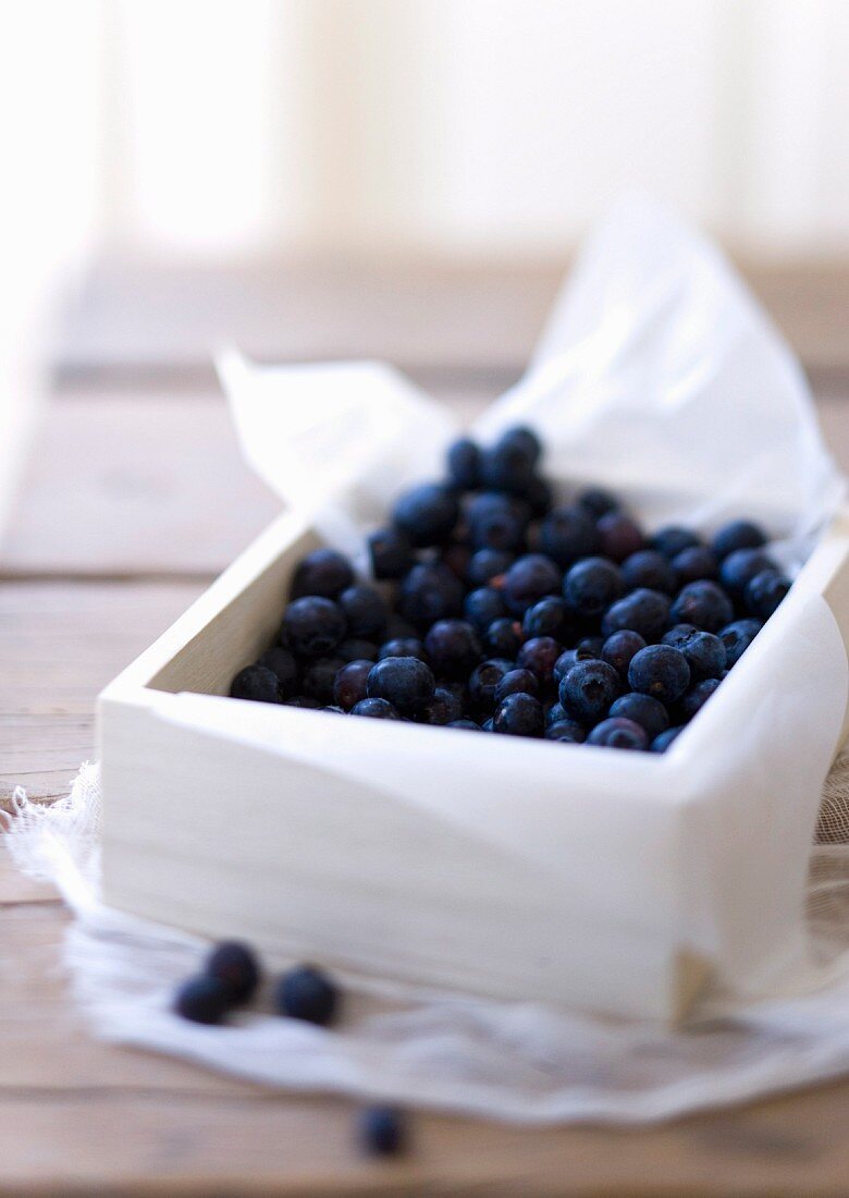 Fresh blueberries in a wooden box
