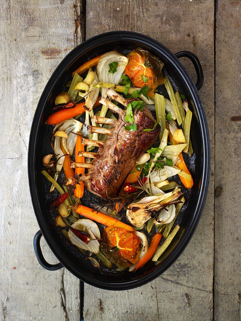 Rack of lamb with vegetables in a roaster