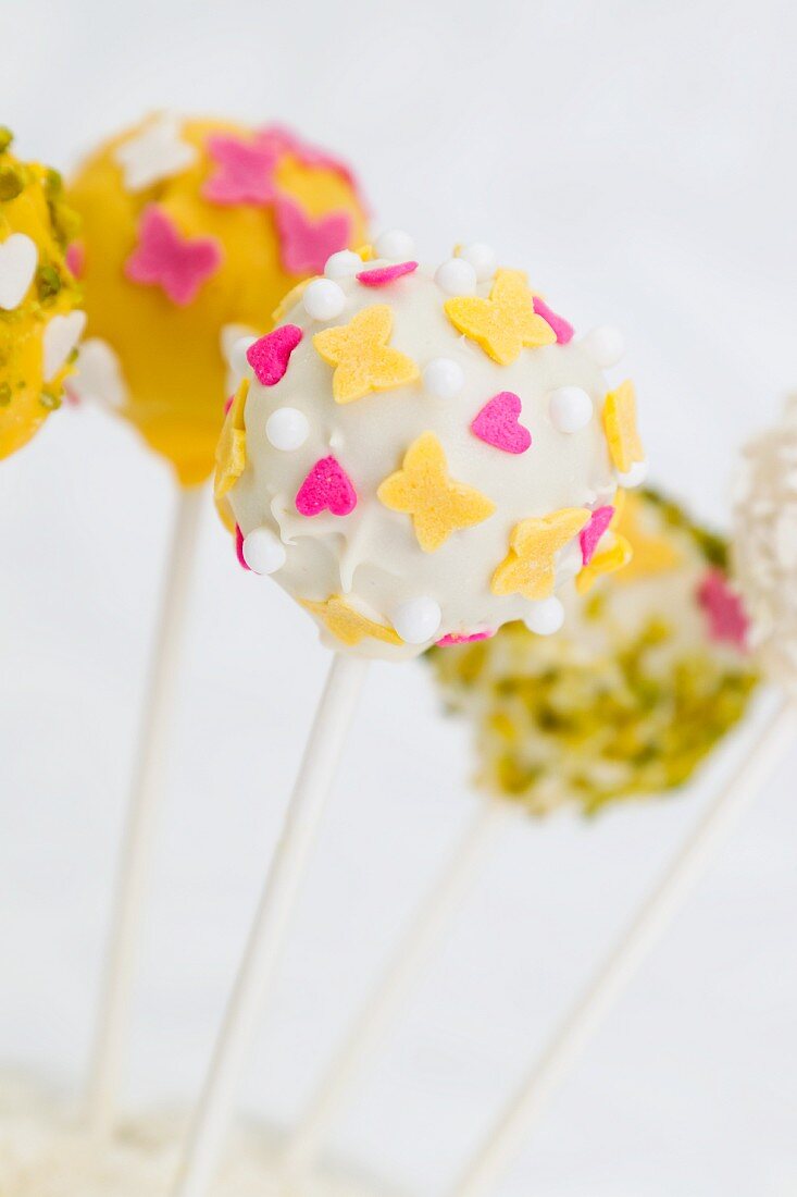Cake pops decorated for spring (hearts, butterflies)