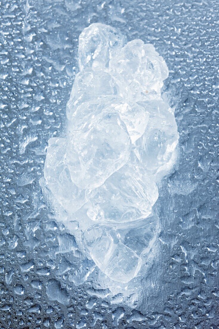 A piece of ice on a wet surface