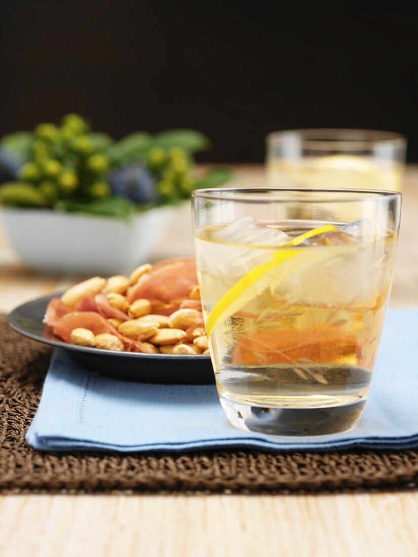 Port tonic cocktail, almonds and prosciutto
