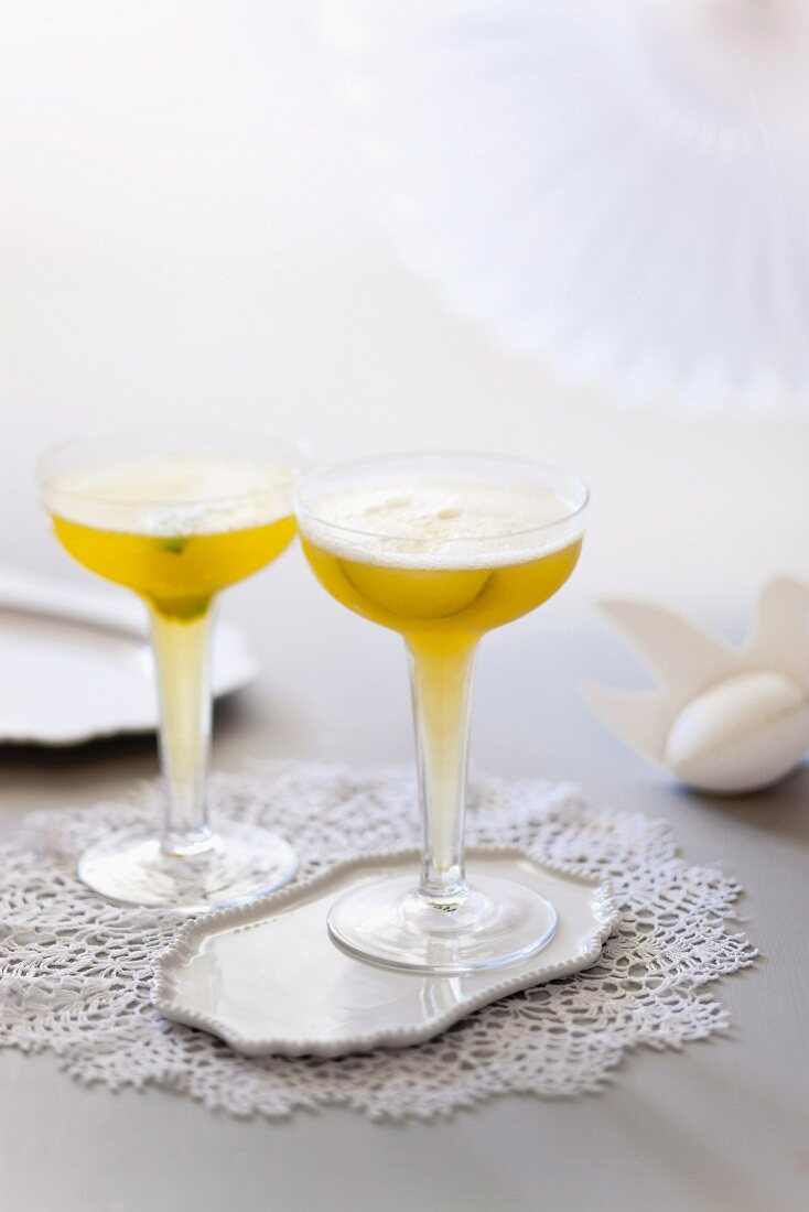 Champagne cocktail with passion fruit and limes
