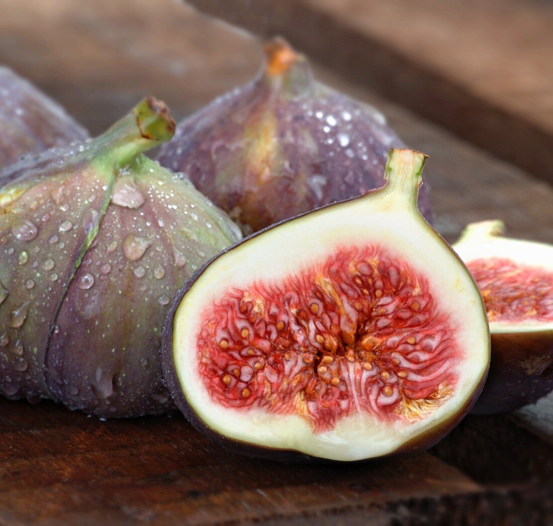 Fresh figs, whole and halved, with water drops