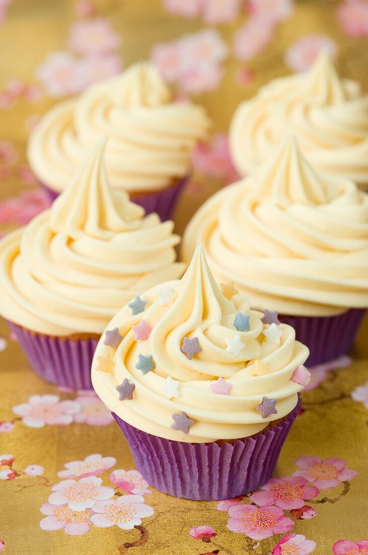 Cupcakes with butter cream and sugar stars