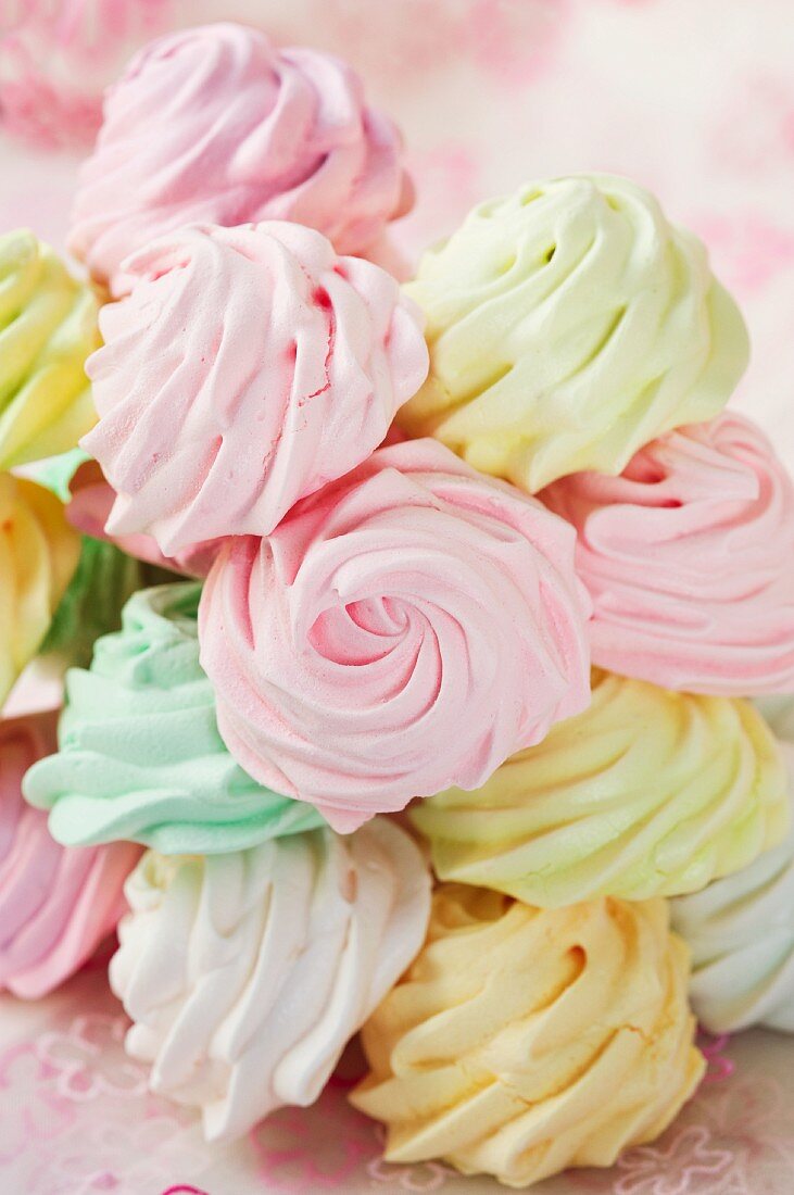 A pile of pastel-colored meringue cookies