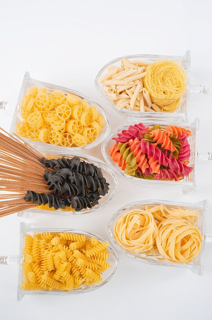 Assorted varieties of pasta in glass storage containers