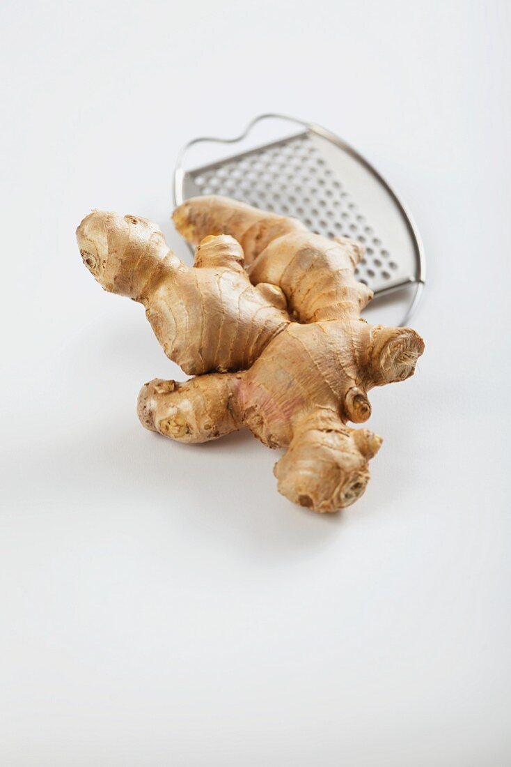 Fresh ginger root with a grater