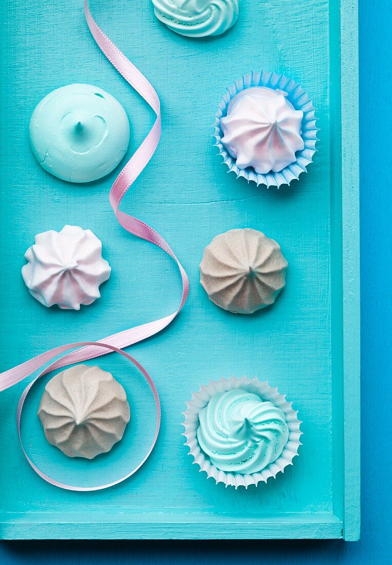 Pastel colored meringues with ribbon