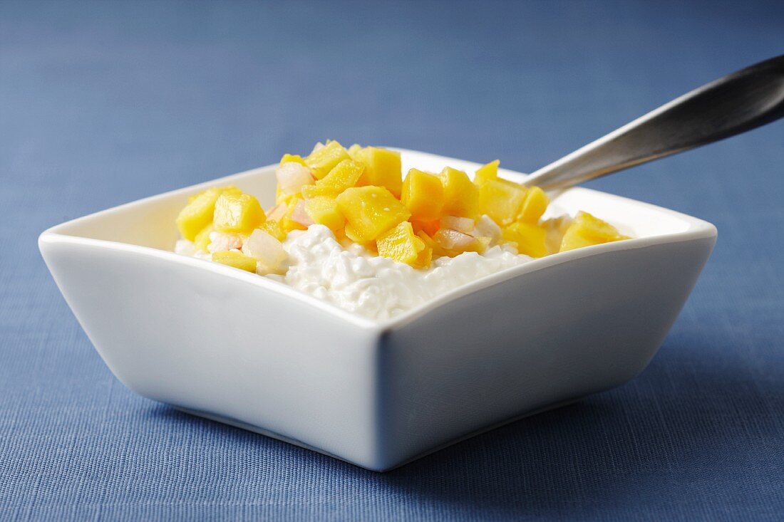 Square Dish of Cottage Cheese Topped with Mango