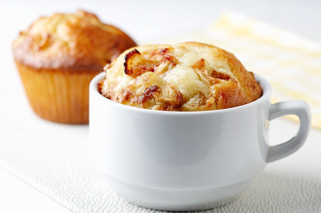 Apple Cinnamon Muffin Baked in a Tea Cup; Muffin in Background