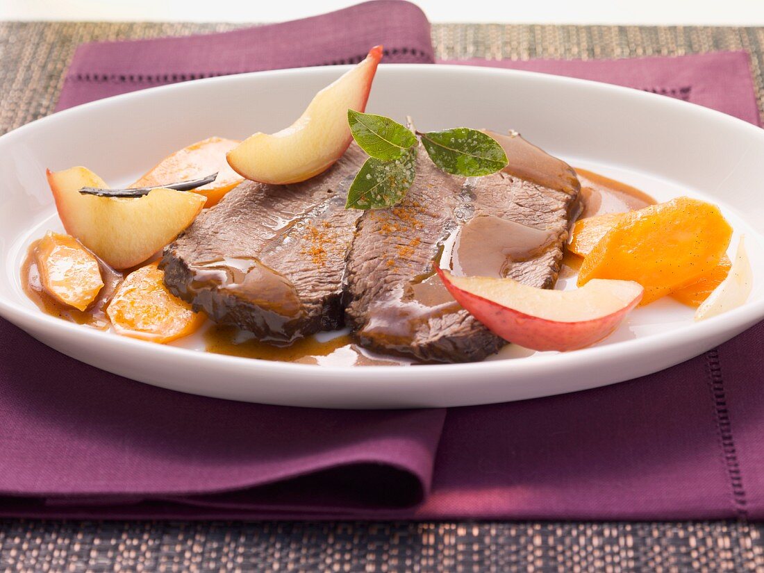 Roast beef with carrots and pears in Burgundy sauce
