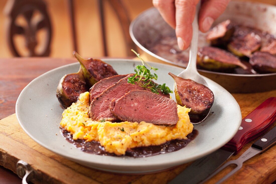 Venison steak with sweet potato puree and figs in red wine