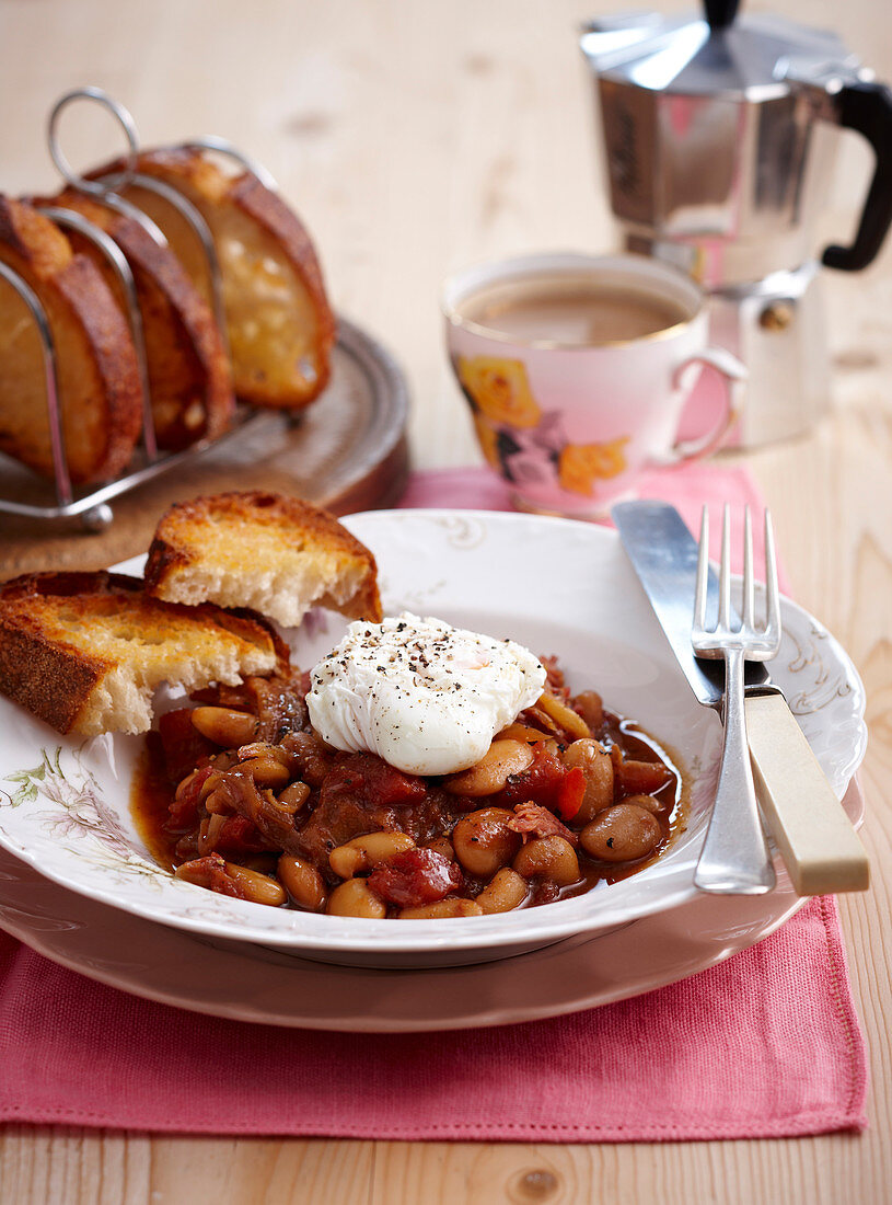 Beans with bacon, poached egg and toast