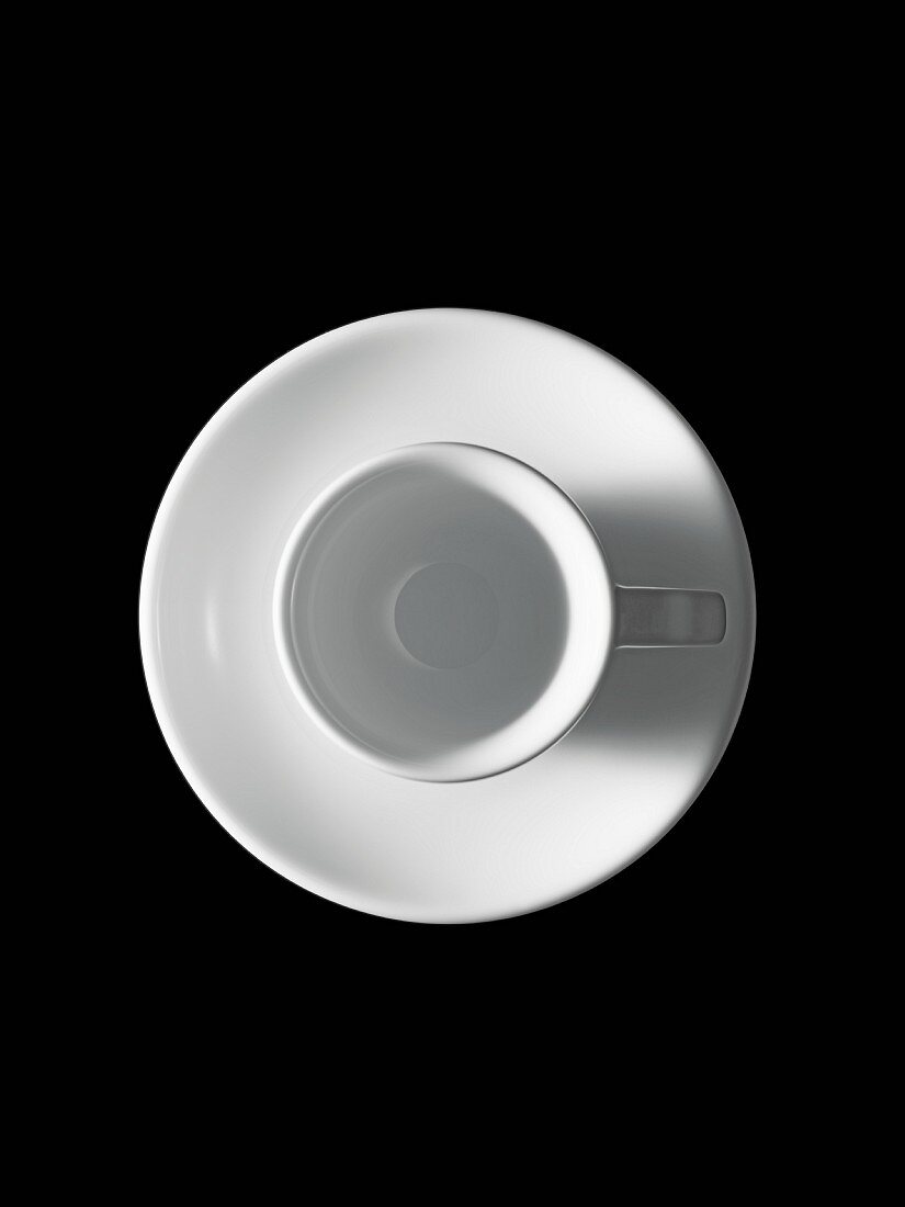 White espresso cup against black background