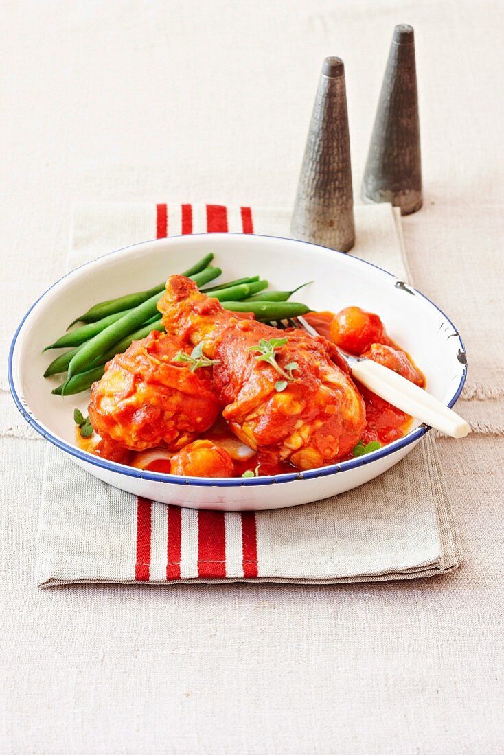 Chicken legs with salami and tomato sauce
