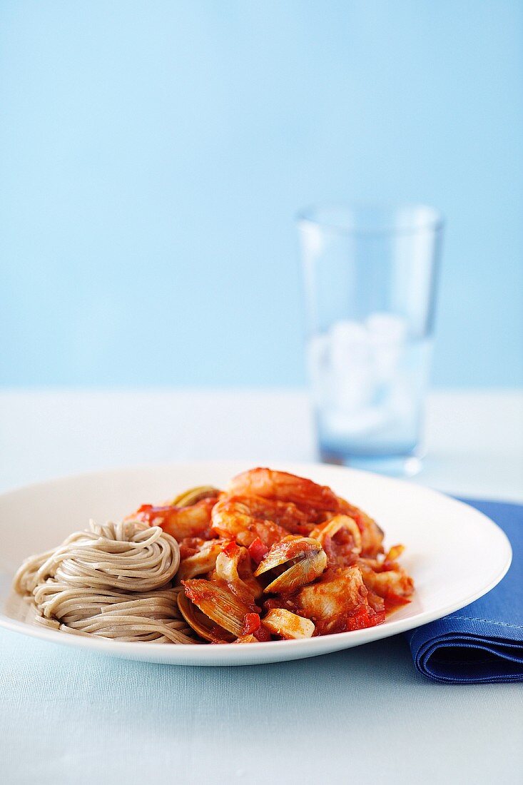 Buckwheat spaghetti with seafood and marinara sauce