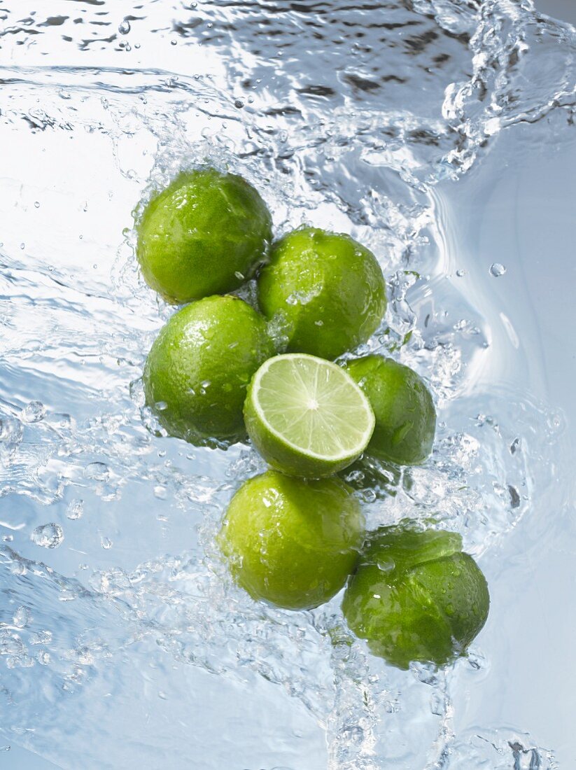 Limes, whole & halved, in water