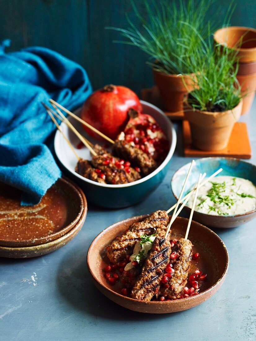 Minced lamb kebabs with pomegranate seeds and a yogurt dip
