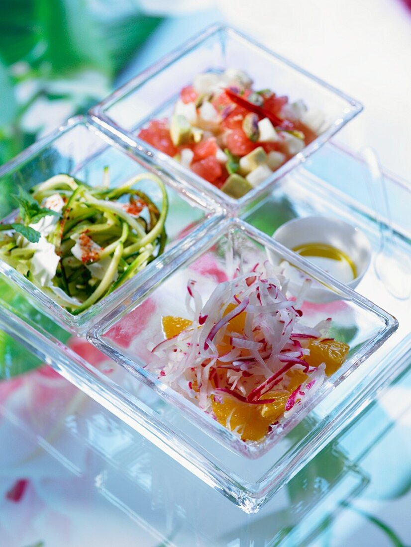 Various salads (radish and orange, courgette and mint, avocado and tomato)