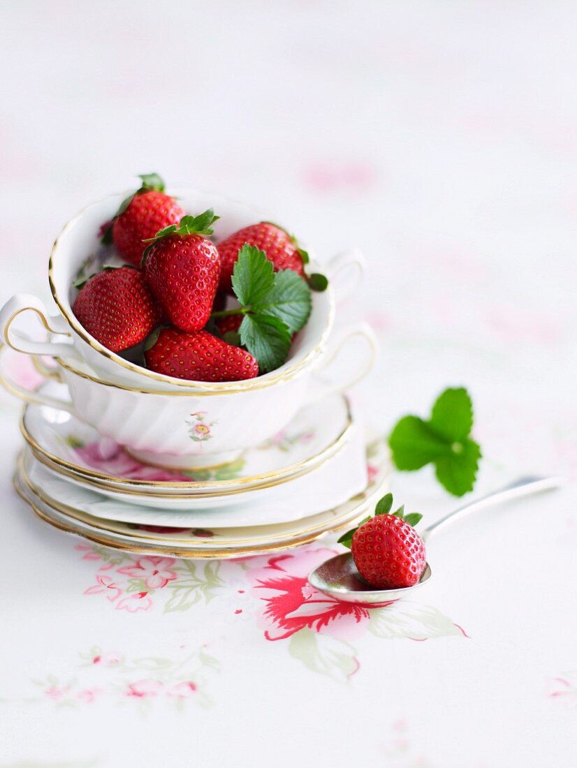 Fresh strawberries in a porcelain cup