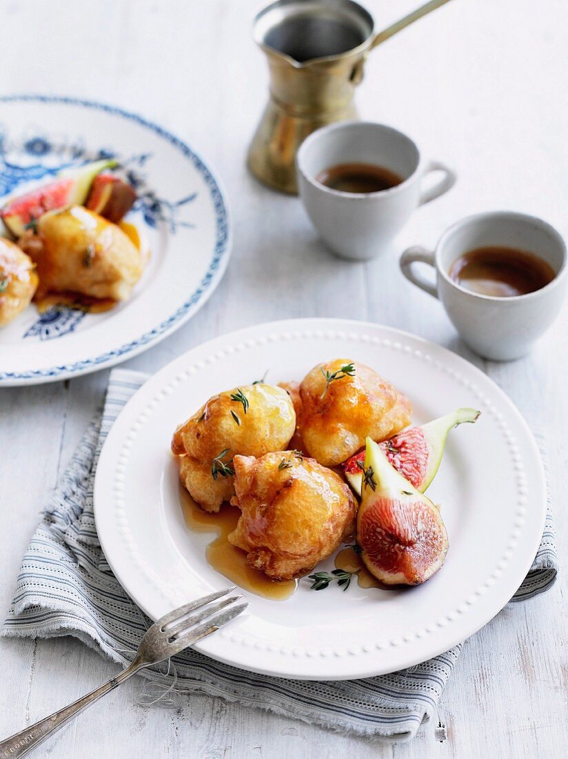 Loukoumades (fried dough balls, Greece) with honey, figs and thyme