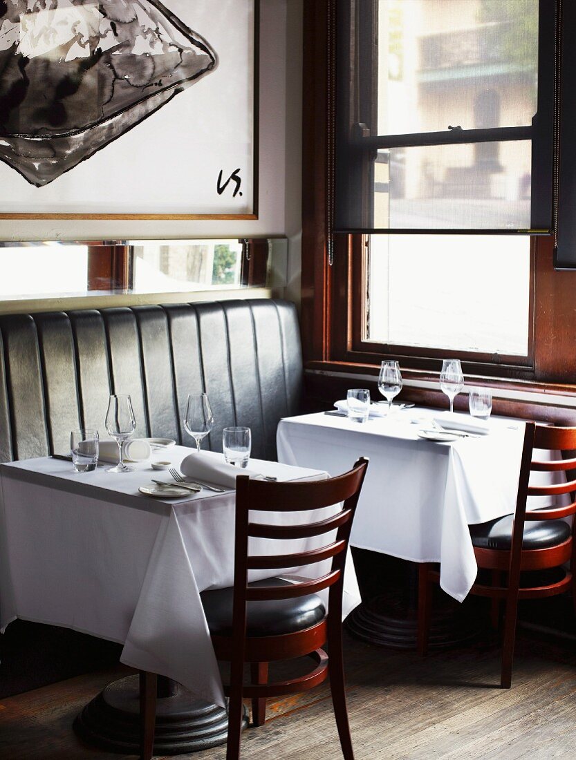 Small table (which has been set) in a restaurant