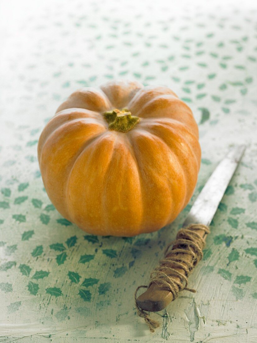 Small muscat pumpkin and a knife