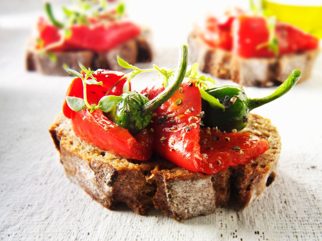 Toasted rye bread with roasted peppers and chili peppers