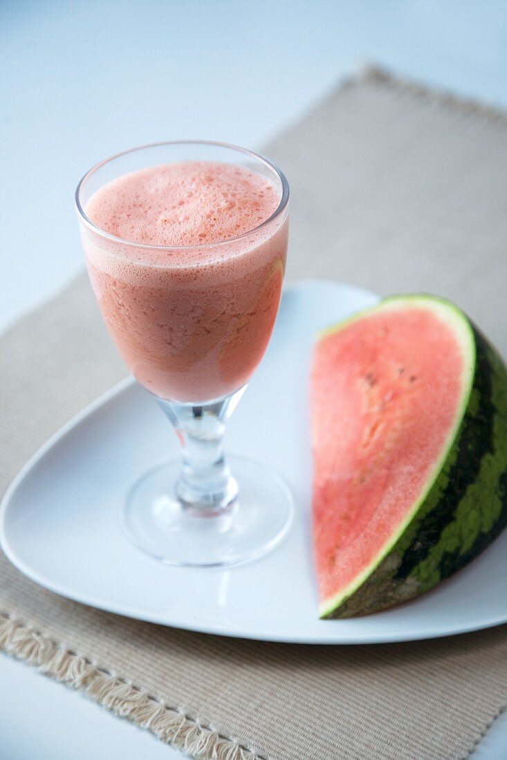 Watermelon Smoothie with a Wedge of Fresh Watermelon