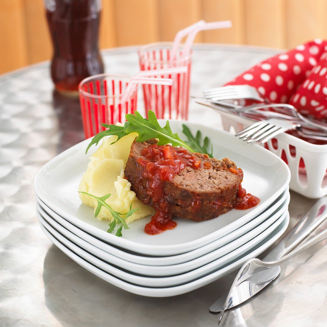 Meatloaf with mashed potatoes and tomato sauce